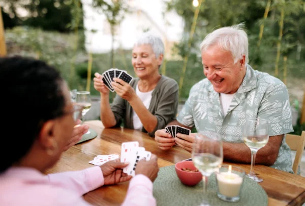 Senior friends playing cards together