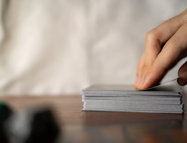 Person preparing to draw a card.